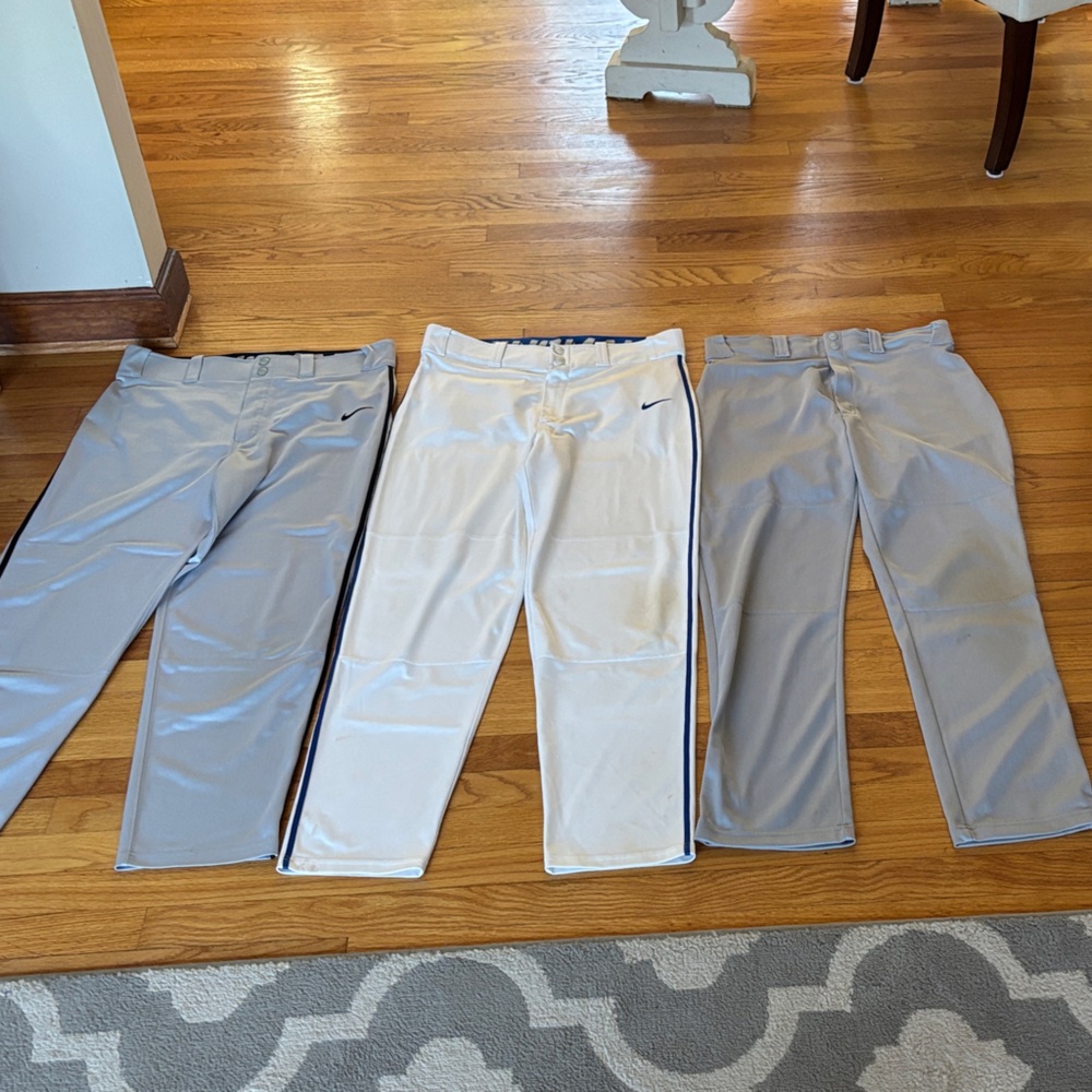 3 pairs of men’s size M Baseball Pants. 2 Nike Swingman (gray & white) 1 Wilson